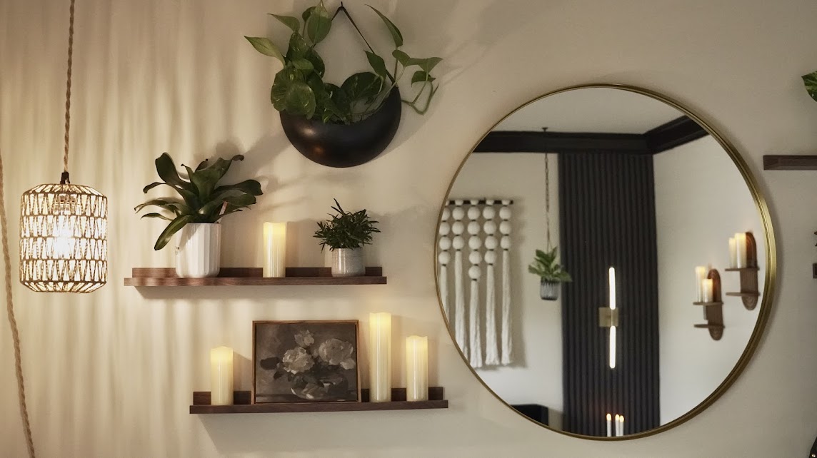 Stylish suite room wall featuring a decorative mirror and elegant decor items creating a warm and inviting ambiance birth center Durham NC