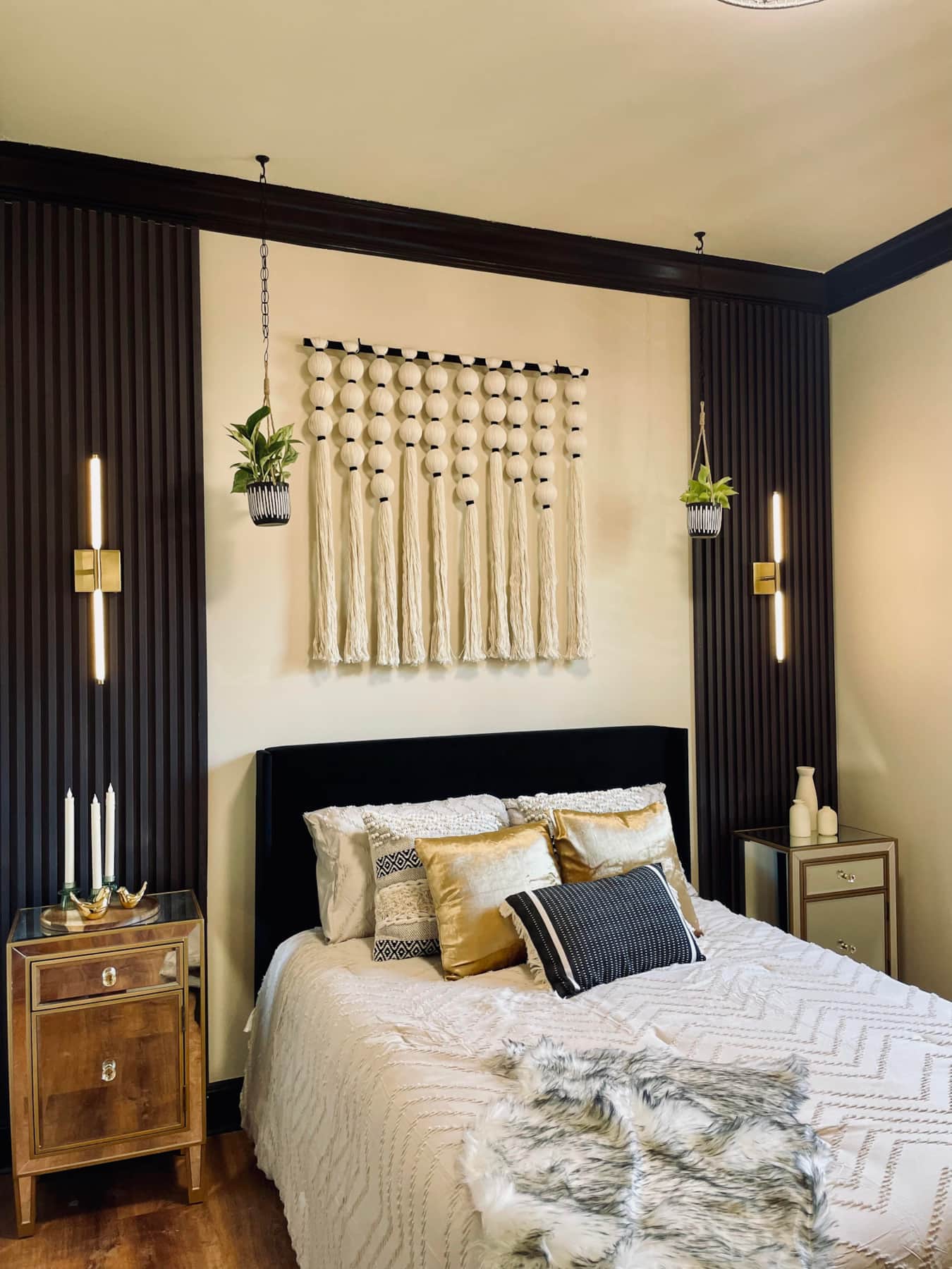 Elegant birth suite bedroom featuring a comfortable bed, soft lighting, and modern furnishings for a relaxing stay birth center Durham NC