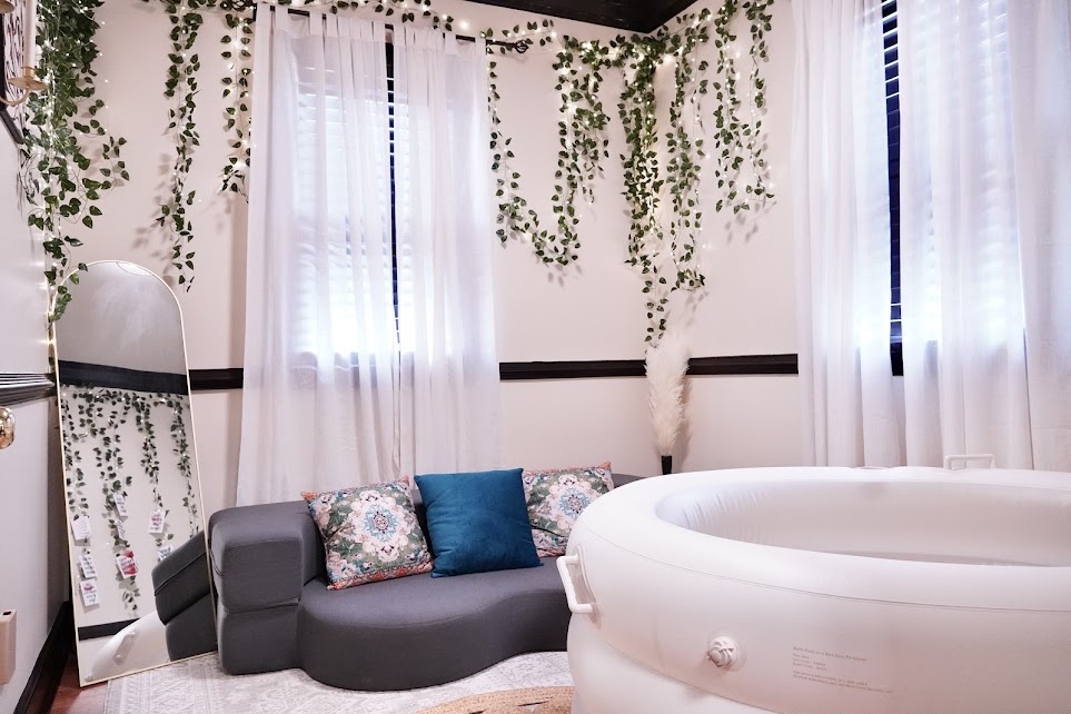 Cozy and well-furnished birth suite bedroom with warm tones and a serene environment for rest and recovery birth center Durham NC
