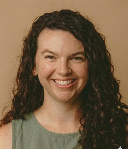 Friendly headshot of midwife Kristina with a warm smile in a professional environment birth center Durham NC